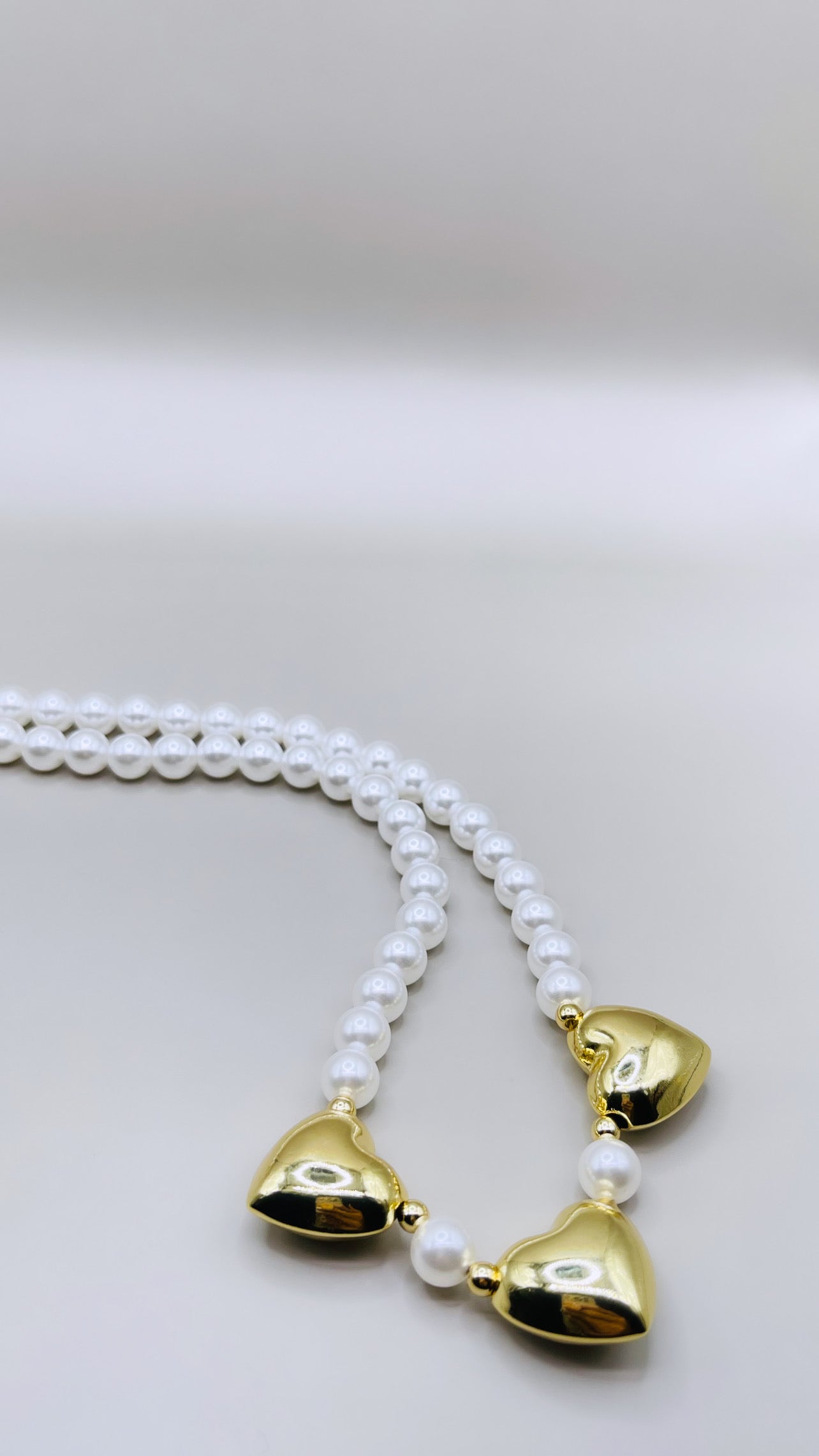 TRIPLE HEARTS PEARLS NECKLACE